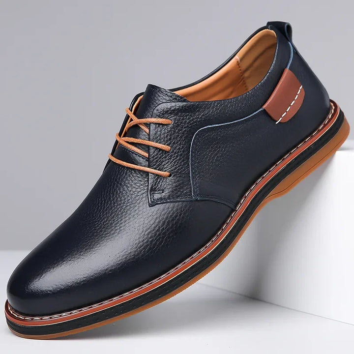 Rovelli men's navy leather dress shoe with tan laces and stitched brown sole