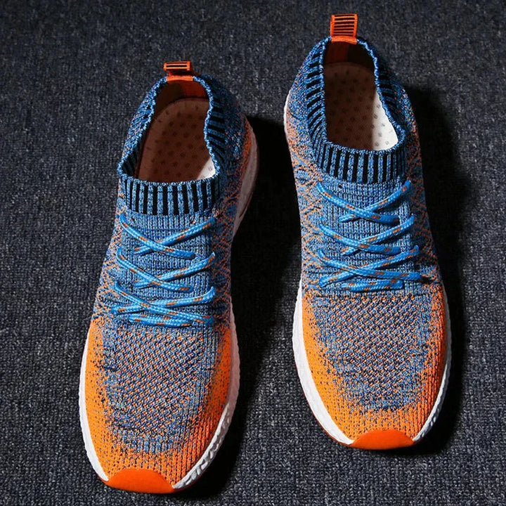 Rovelli knit sneakers in blue and orange on dark textured surface
