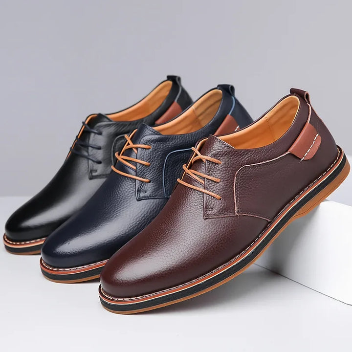 Rovelli men's leather dress shoes in brown, navy, and black with tan laces on display