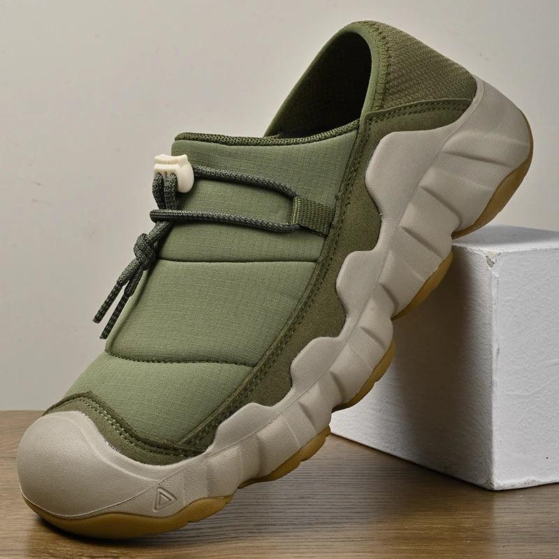Rovelli olive green slip-on casual shoe with thick sole and toggle lace, displayed indoors