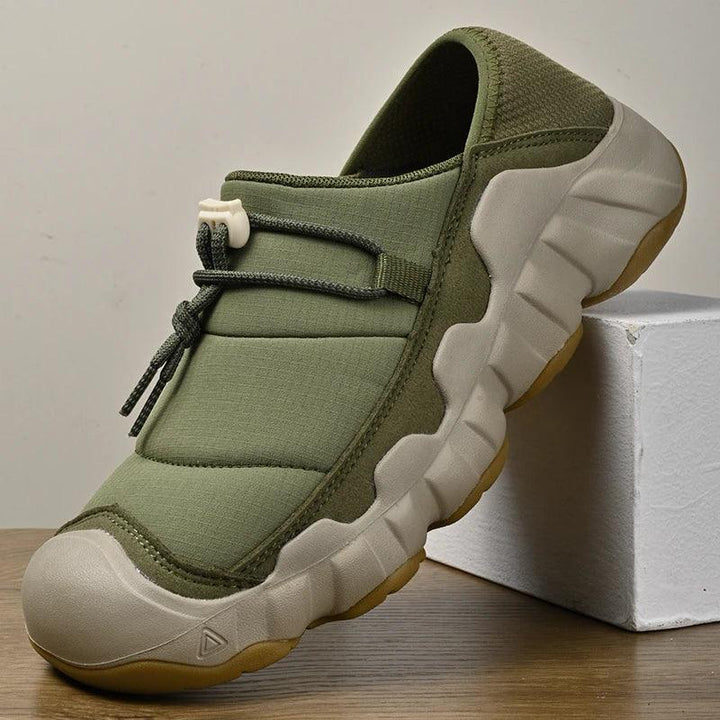 Rovelli olive green slip-on casual shoe with thick sole and toggle lace, displayed indoors