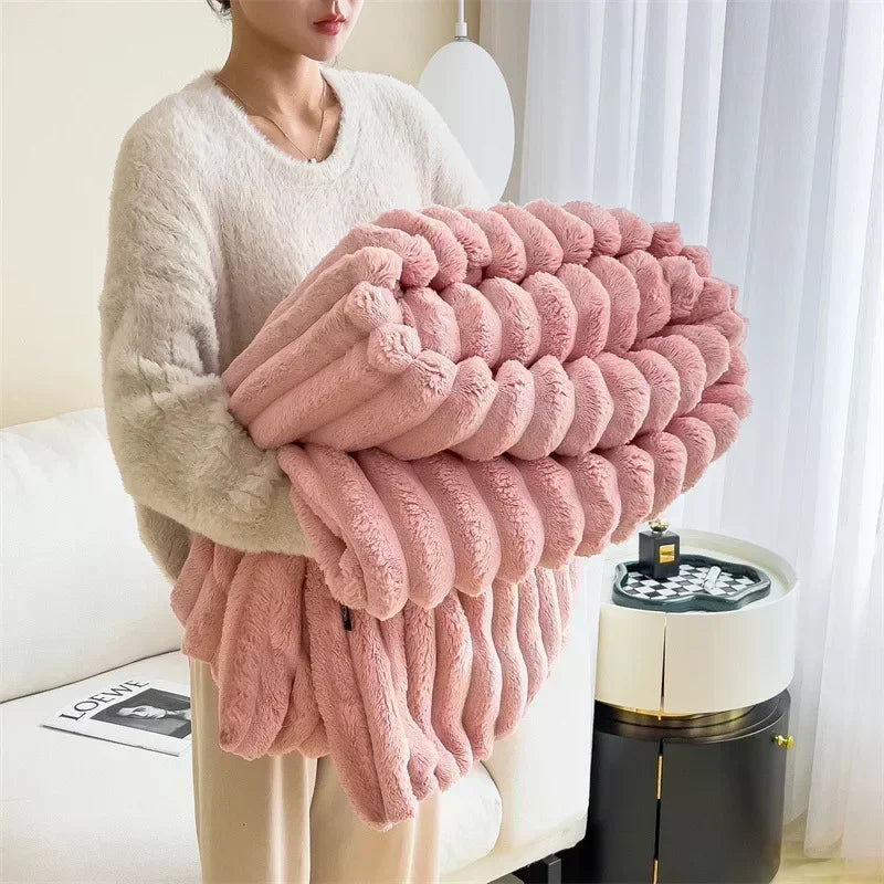 Woman holding a large pink fluffy blanket in a cozy modern living room, Rovelli home decor