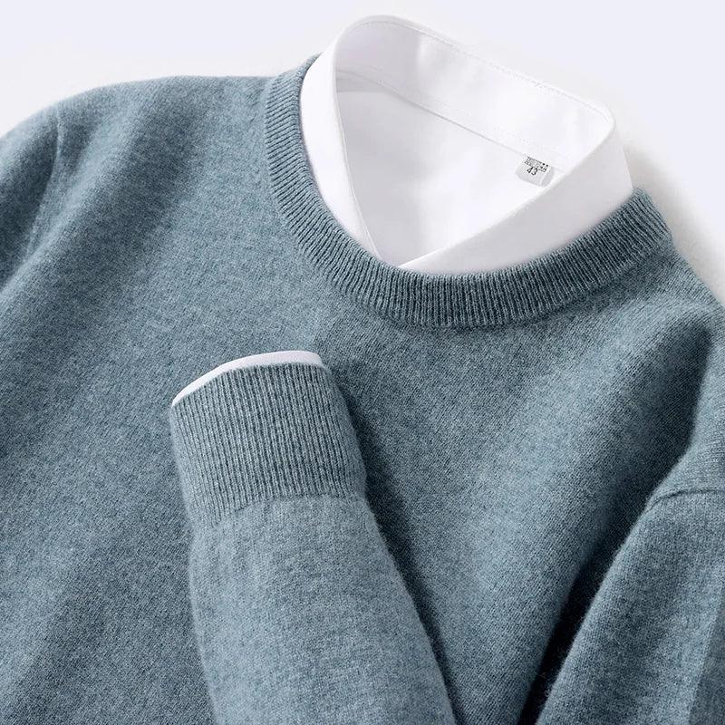 Blue crew neck sweater over white collared shirt, Rovelli clothing detail