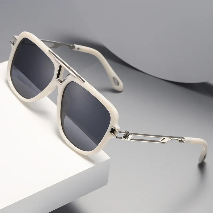 Off-white, luxury designer square sunglasses with silver metal arms and dark lenses rest on a white and gray surface in a minimalist setting.