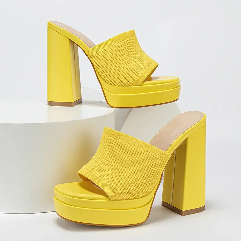 Yellow platform block heel mules with ribbed knit uppers on a white background, Rovelli shoes