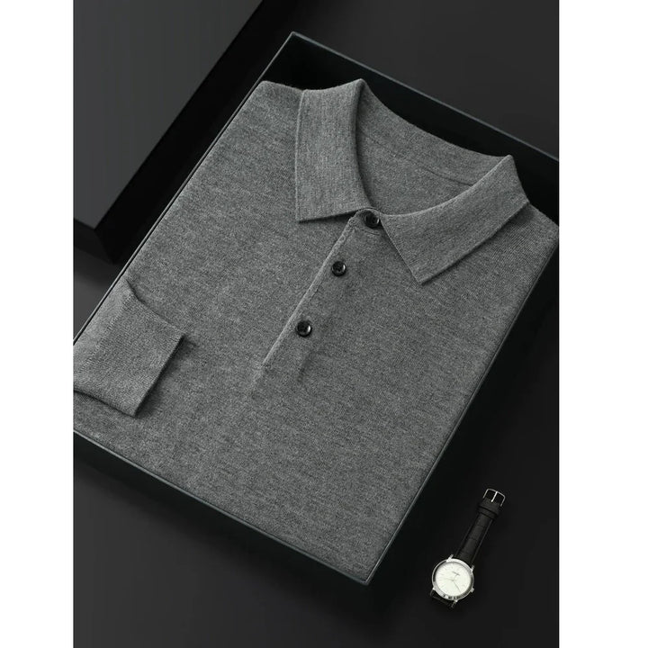Folded gray Rovelli polo shirt in a box beside a black leather strap watch
