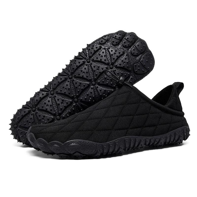 Rovelli black quilted slip-on shoes with textured rubber sole, outdoor footwear