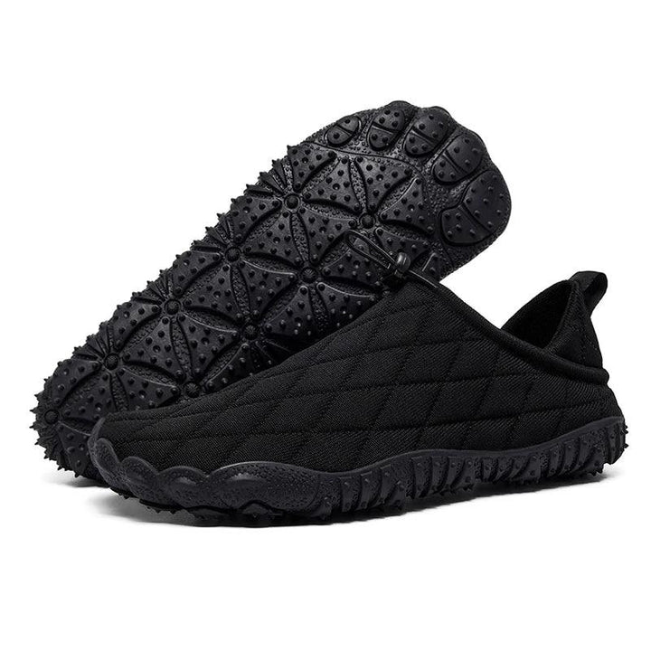 Rovelli black quilted slip-on shoes with textured rubber sole, outdoor footwear