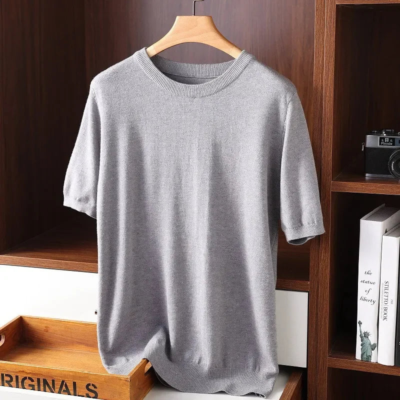 Rovelli light grey short sleeve knit sweater on hanger in wooden shelving display