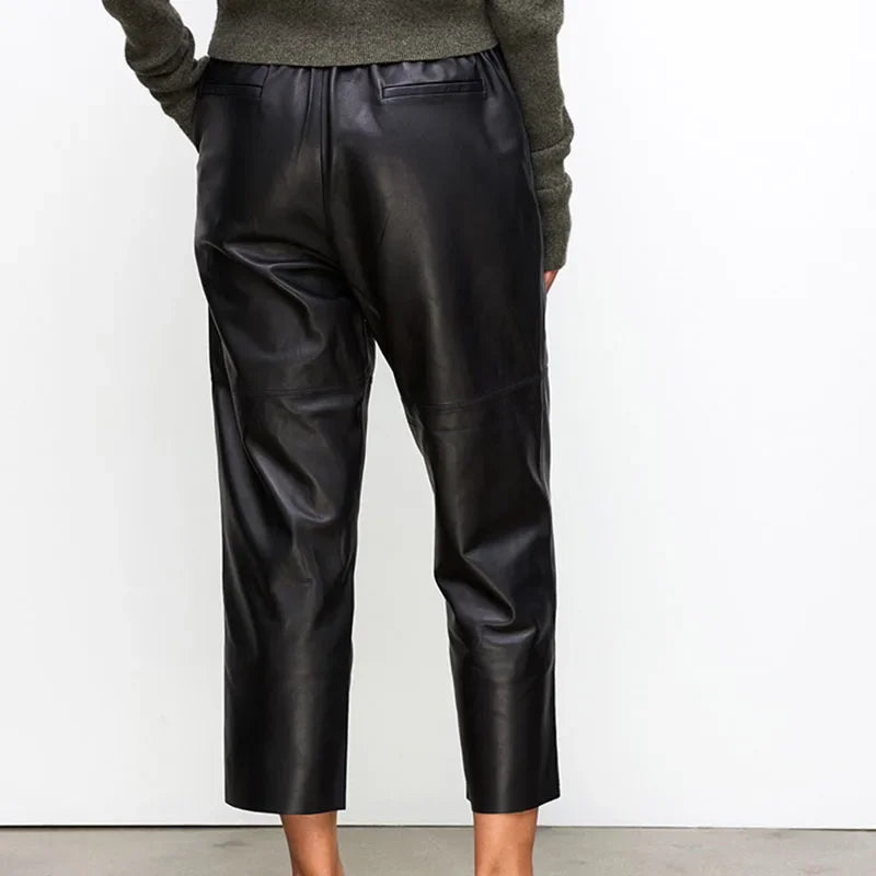 Rovelli black leather cropped pants back view, styled with a green sweater
