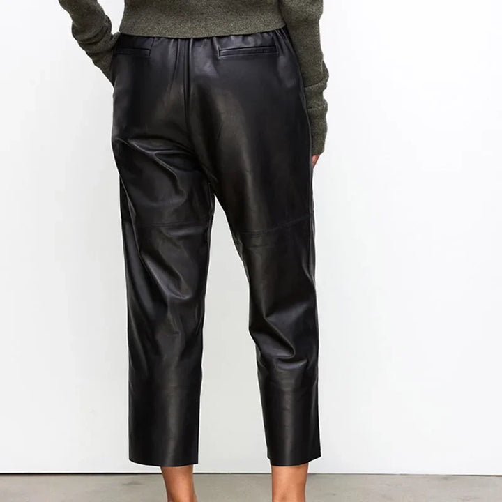 Rovelli black leather cropped pants back view, styled with a green sweater