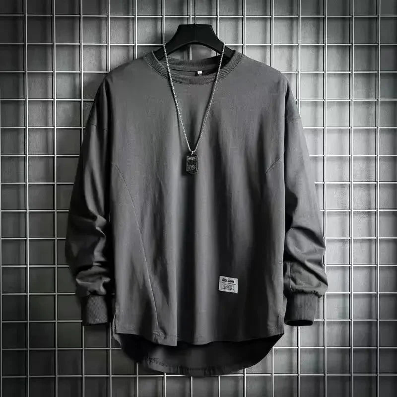 Rovelli dark grey long sleeve shirt with necklace on hanger, grid wall background