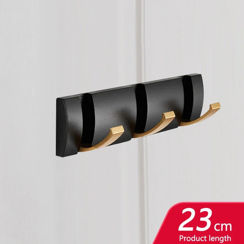 Rovelli black and gold wall-mounted hook rack, 23cm, modern design on white wall