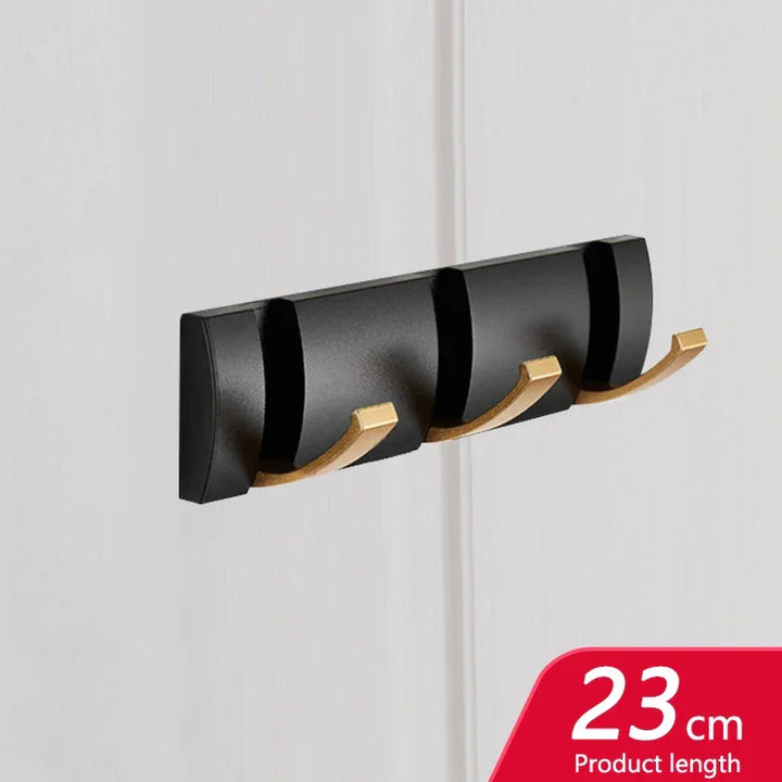 Rovelli black and gold wall-mounted hook rack, 23cm, modern design on white wall