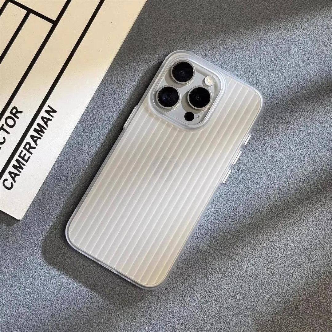 A silver smartphone with a slim lightweight design and a scratch-resistant cover lies on a textured gray surface next to a white sheet of paper labeled CAMERAMAN in black text.