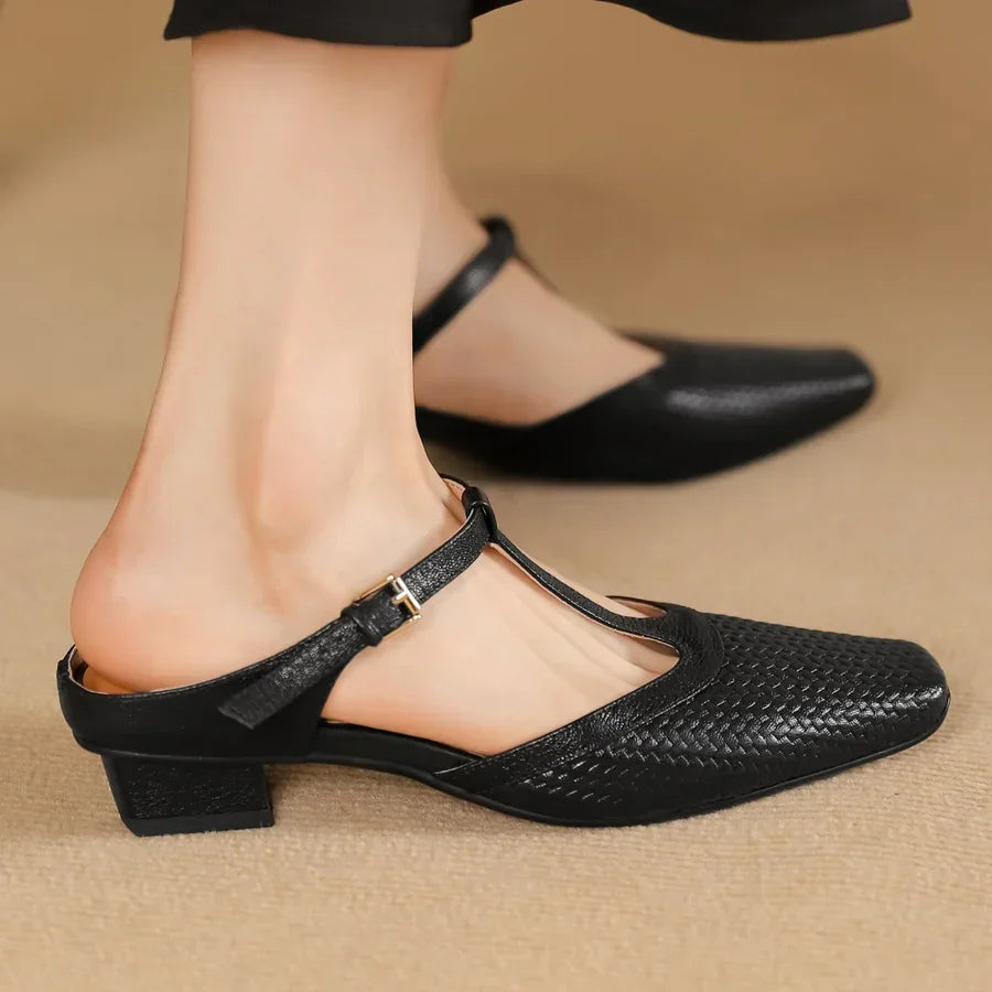 Rovelli black woven leather T-strap block heel shoe for women on beige background