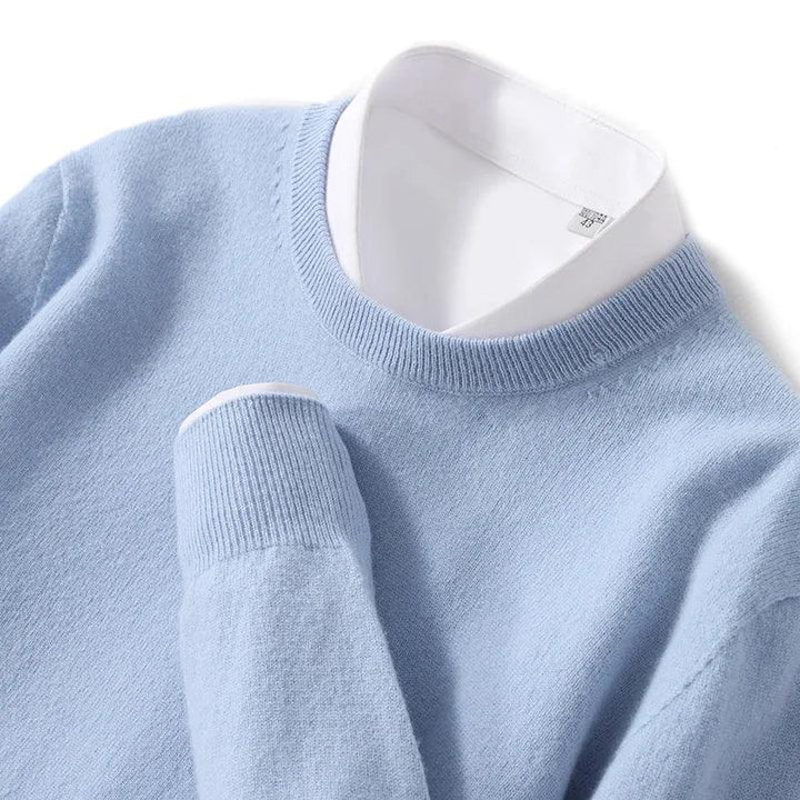 Light blue knit sweater with white collar, Rovelli fashion, neatly folded