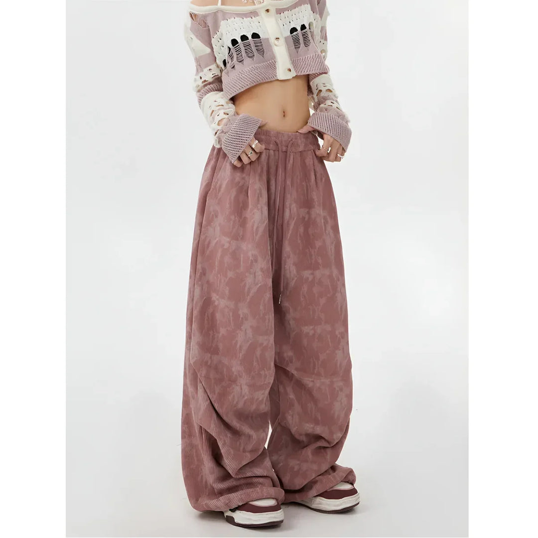 Model wearing pink wide leg pants and cropped knit sweater, Rovelli fashion