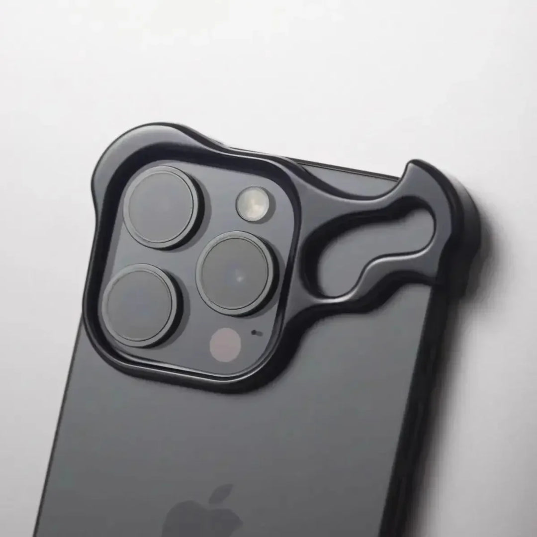 A black smartphone with a protective camera cover shaped like a cartoon bear’s face, featuring lens film protection that outlines the camera lenses and flash.
