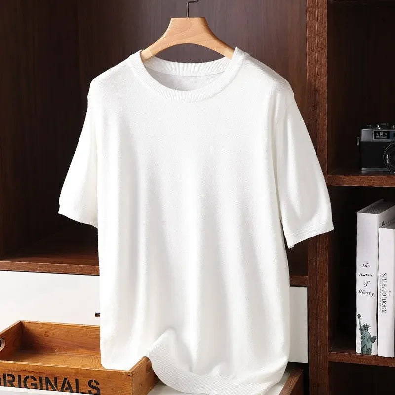 Rovelli plain white short sleeve knit shirt on hanger, displayed in wooden shelf