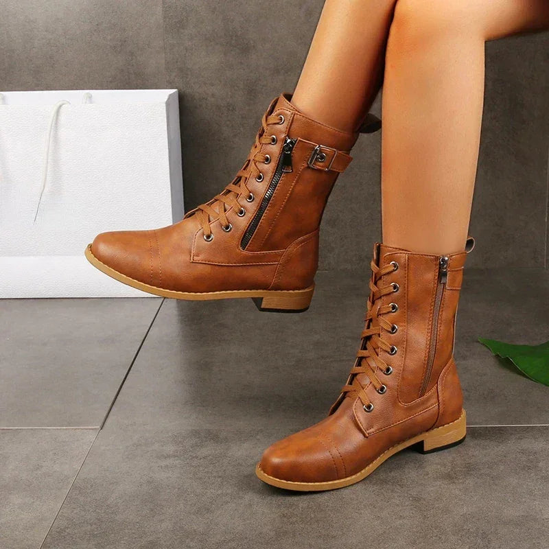 Rovelli brown lace-up ankle boots with side zipper on model, modern stylish footwear