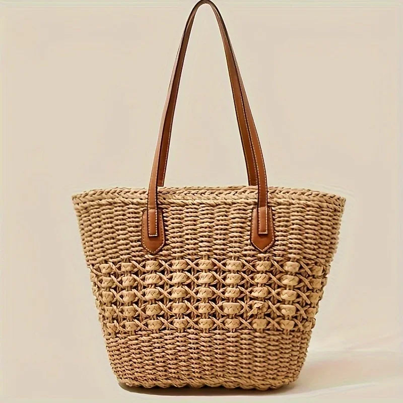 Rovelli woven straw tote bag with brown handles on neutral background