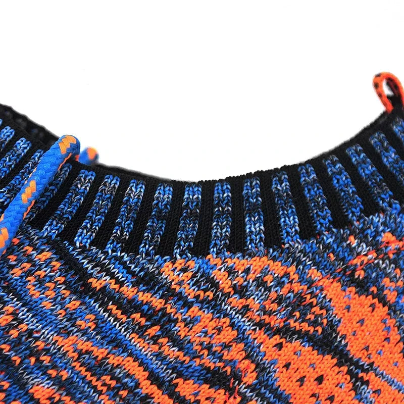 Close-up of Rovelli knit sweater collar with blue, orange, and black patterned yarn.