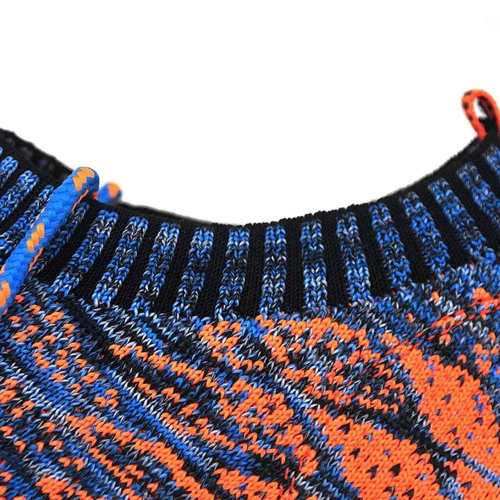 Close-up of Rovelli knit sweater collar with blue, orange, and black patterned yarn.