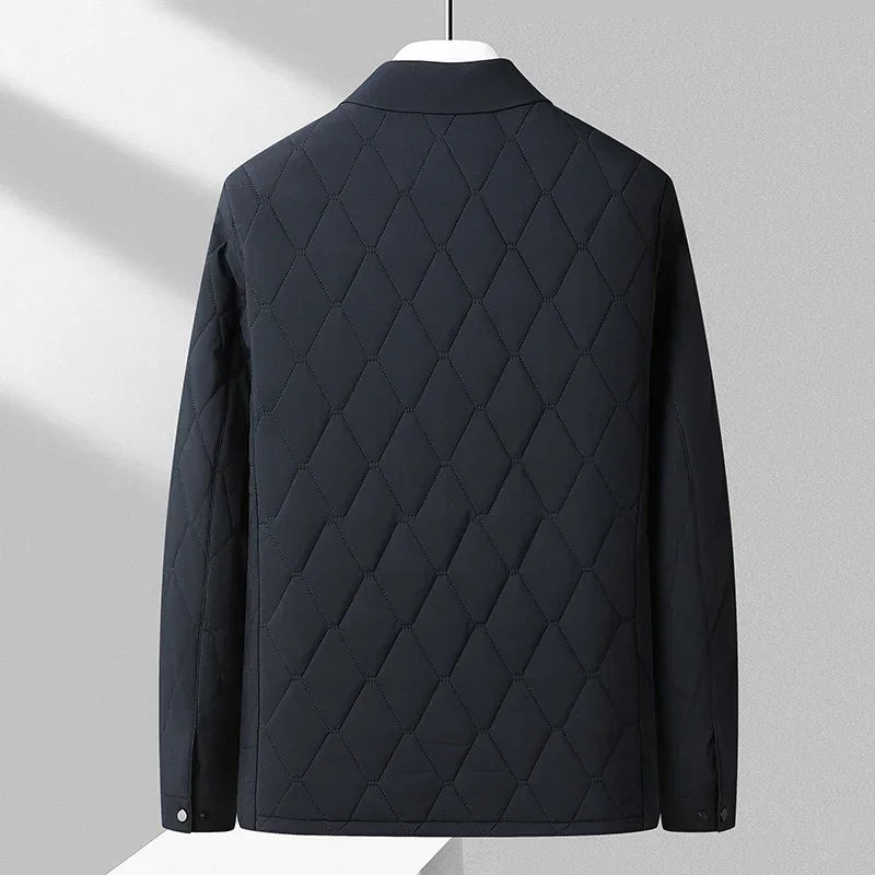 Rovelli black diamond-quilted jacket back view on hanger in modern setting