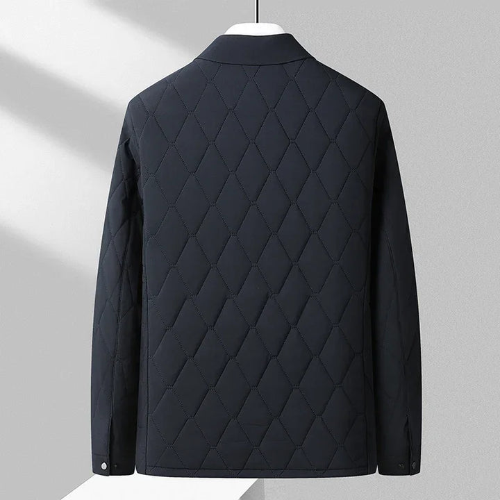 Rovelli black diamond-quilted jacket back view on hanger in modern setting