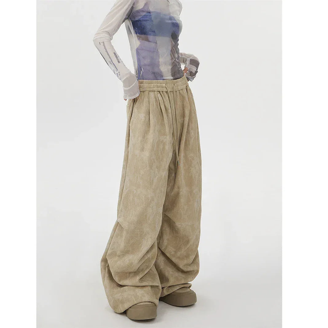 Rovelli wide-leg beige corduroy pants with drawstring waist and sheer long-sleeve top