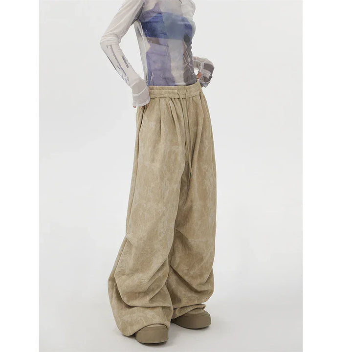 Rovelli wide-leg beige corduroy pants with drawstring waist and sheer long-sleeve top