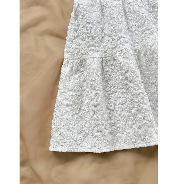 Rovelli white textured floral skirt on beige background