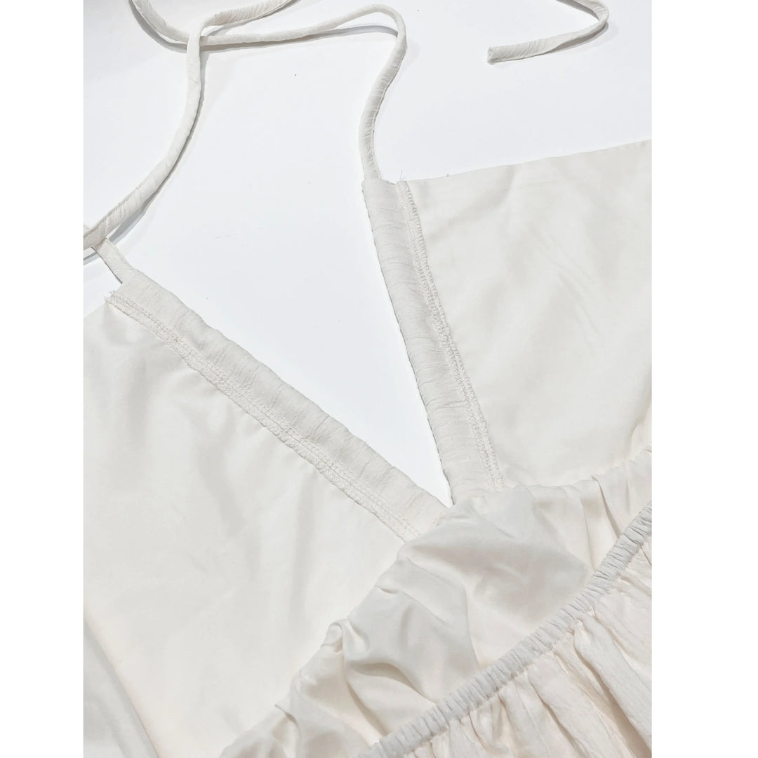 Rovelli cream white dress close-up with V-neckline and ruffle detail