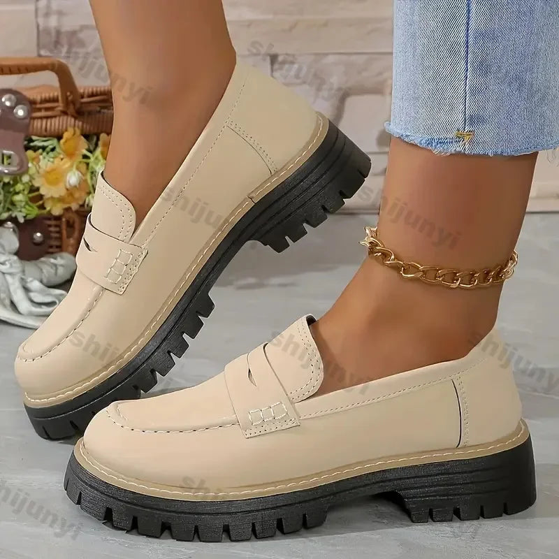 Beige chunky loafers with black soles worn with jeans, Rovelli fashion footwear