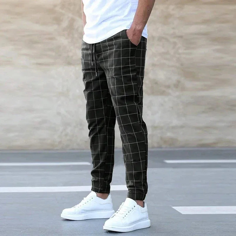 Rovelli men's black windowpane jogger pants with drawstring, paired with white sneakers