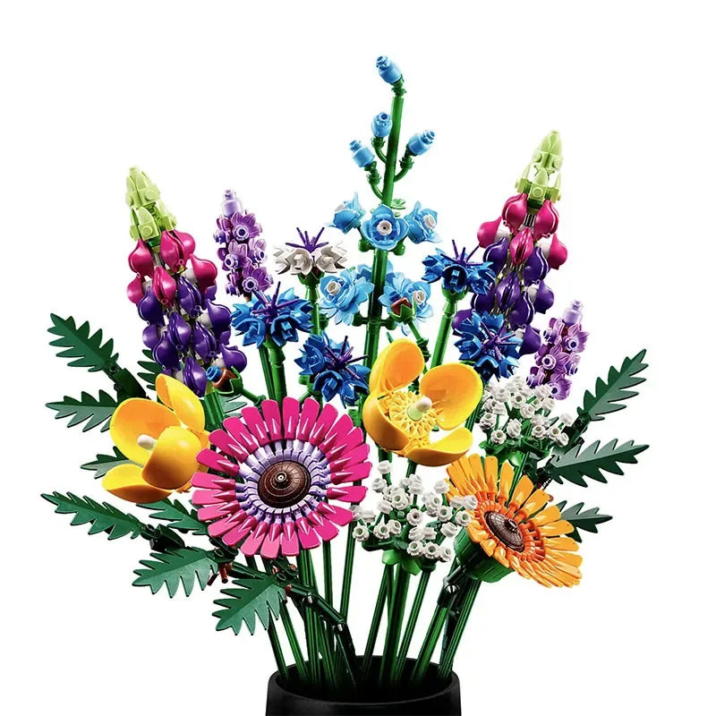 A vibrant Wildflower Bouquet made of LEGO building blocks features pink, yellow, orange, blue, and purple flowers with green leaves and stems, arranged in a black vase against a white background—a unique take on floral designs.