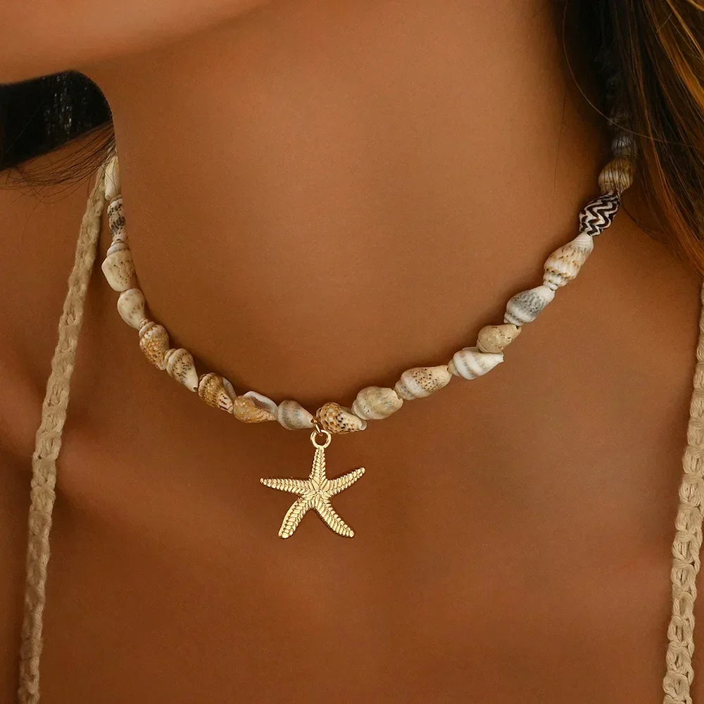 Rovelli shell necklace with gold starfish pendant on woman's neck