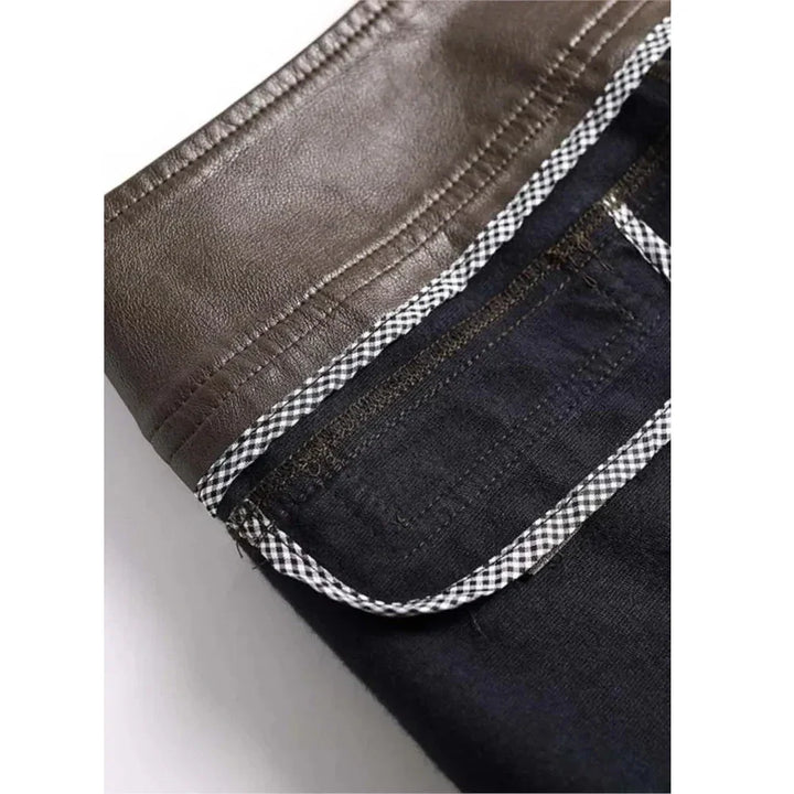 Close-up of Rovelli jeans with brown faux leather waistband and checkered trim detail