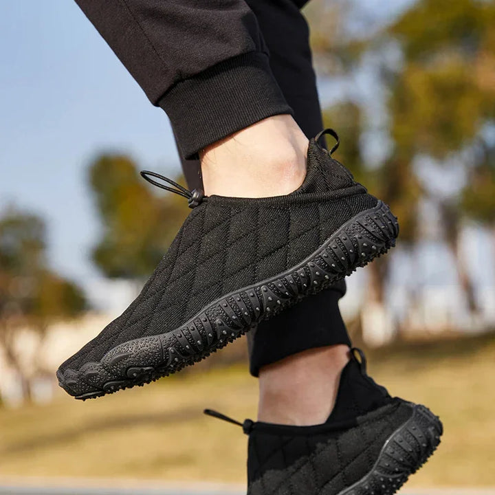 Rovelli black quilted slip-on sneakers with textured soles outdoors