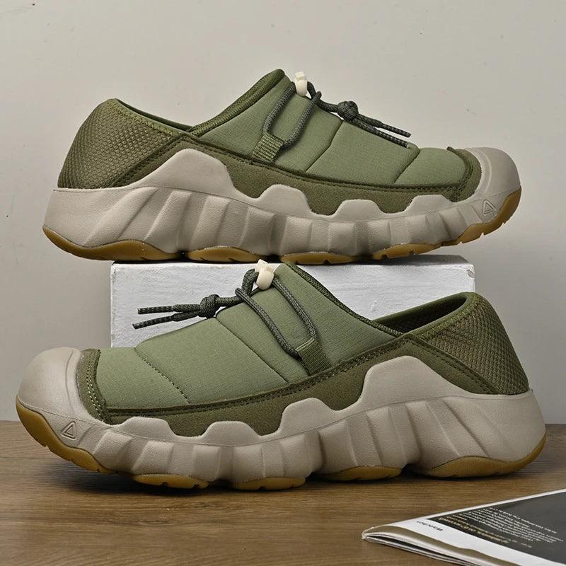 Rovelli olive green slip-on sneakers with thick beige sole on display, casual footwear