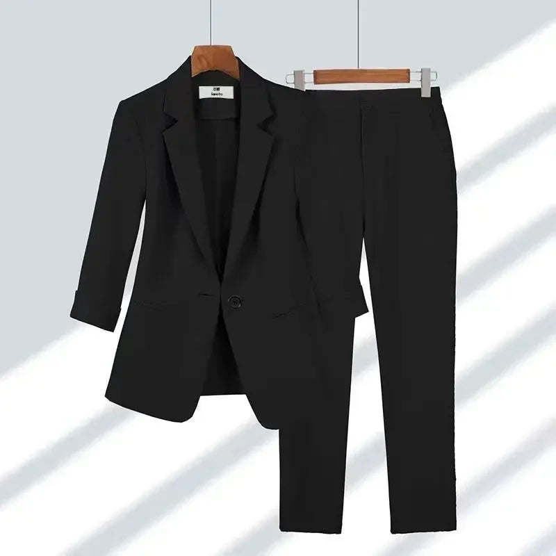 Rovelli black women's business suit with blazer and pants on hangers