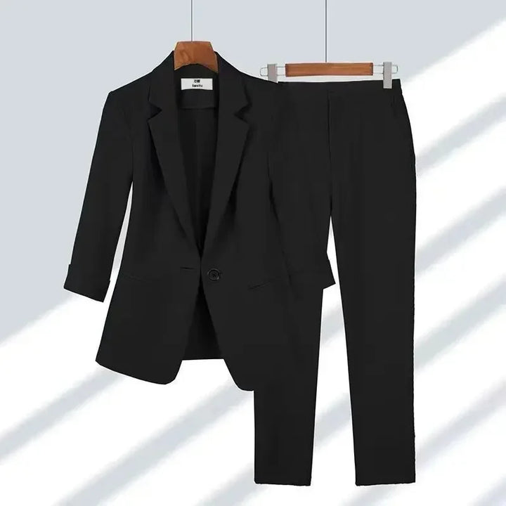 Rovelli black women's business suit with blazer and pants on hangers