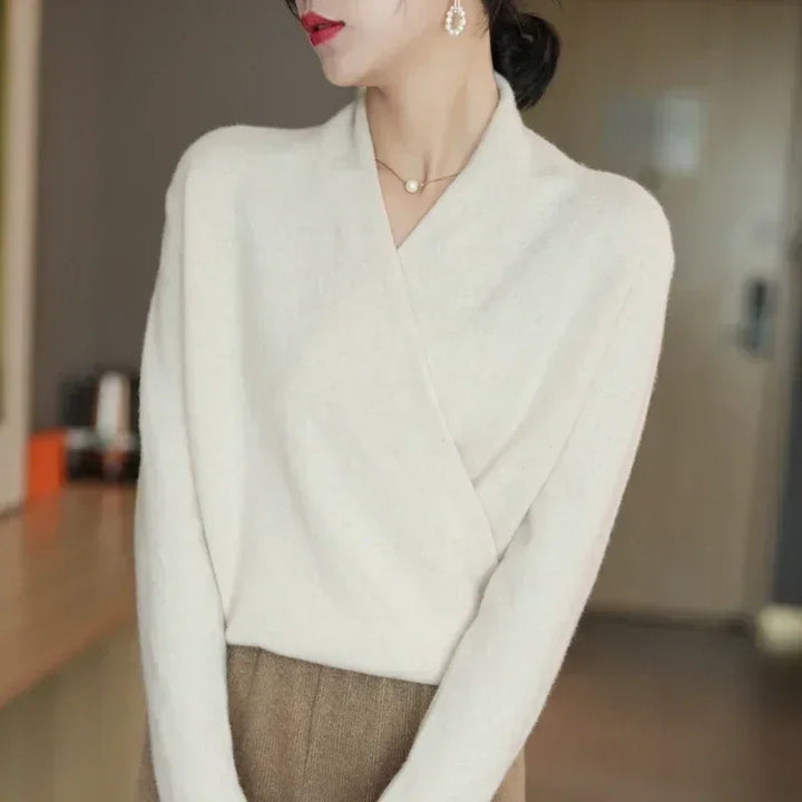 Woman wearing elegant cream knit wrap sweater and brown skirt, Rovelli fashion