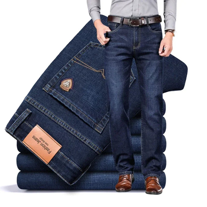Rovelli men’s straight fit dark blue denim jeans with brown belt and dress shoes.