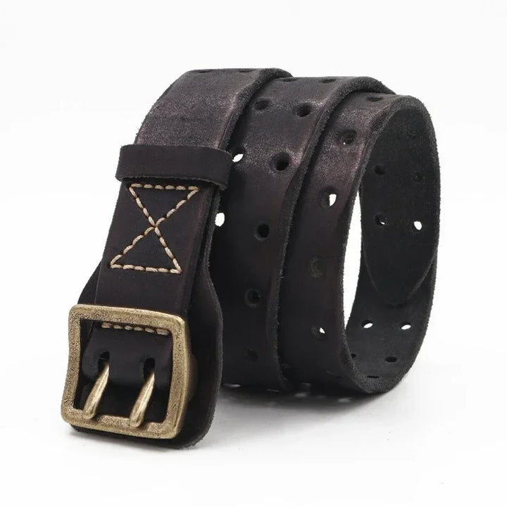 A dark brown cowhide belt with multiple round holes, tan stitching, and a brass buckle, coiled on a white background for a rugged aesthetic.