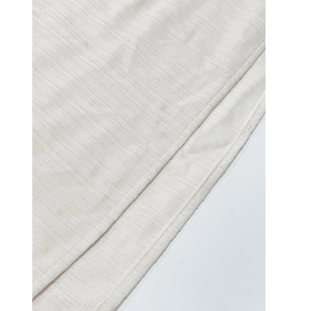Rovelli close-up of soft off-white textured fabric with fine stitching detail