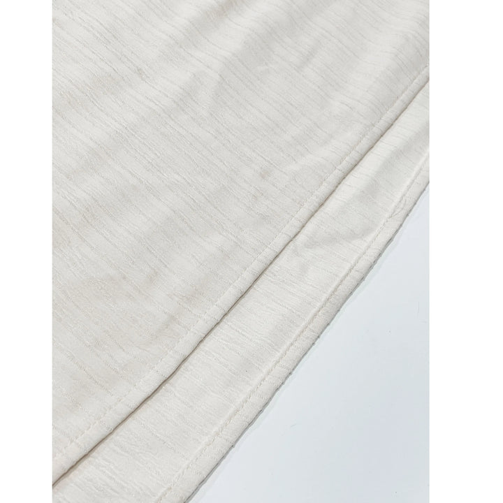 Rovelli close-up of soft off-white textured fabric with fine stitching detail