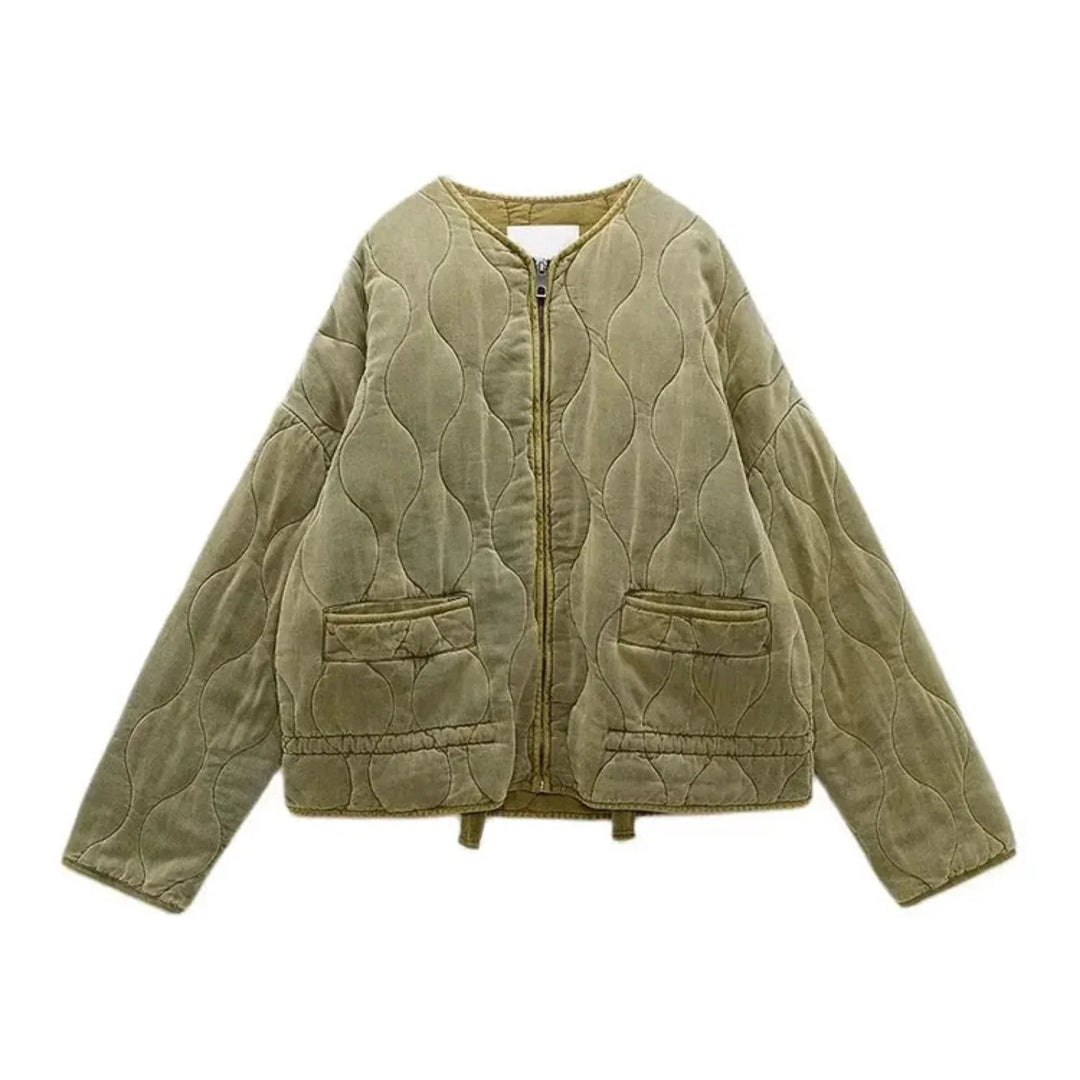 A light brown quilted bomber jacket with padded insulation, featuring a front zipper, two front pockets, and a round collar, displayed on a white background.