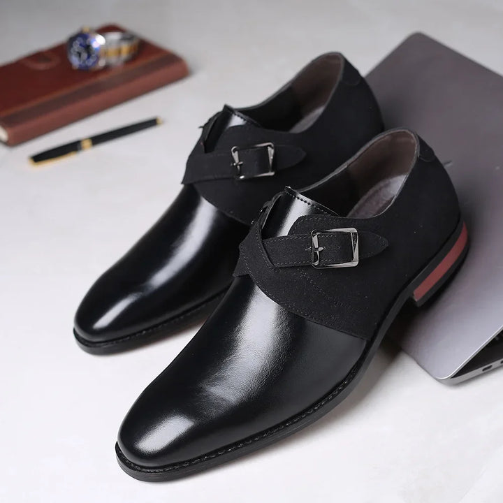 Rovelli black leather monk strap dress shoes with buckle details on a light surface